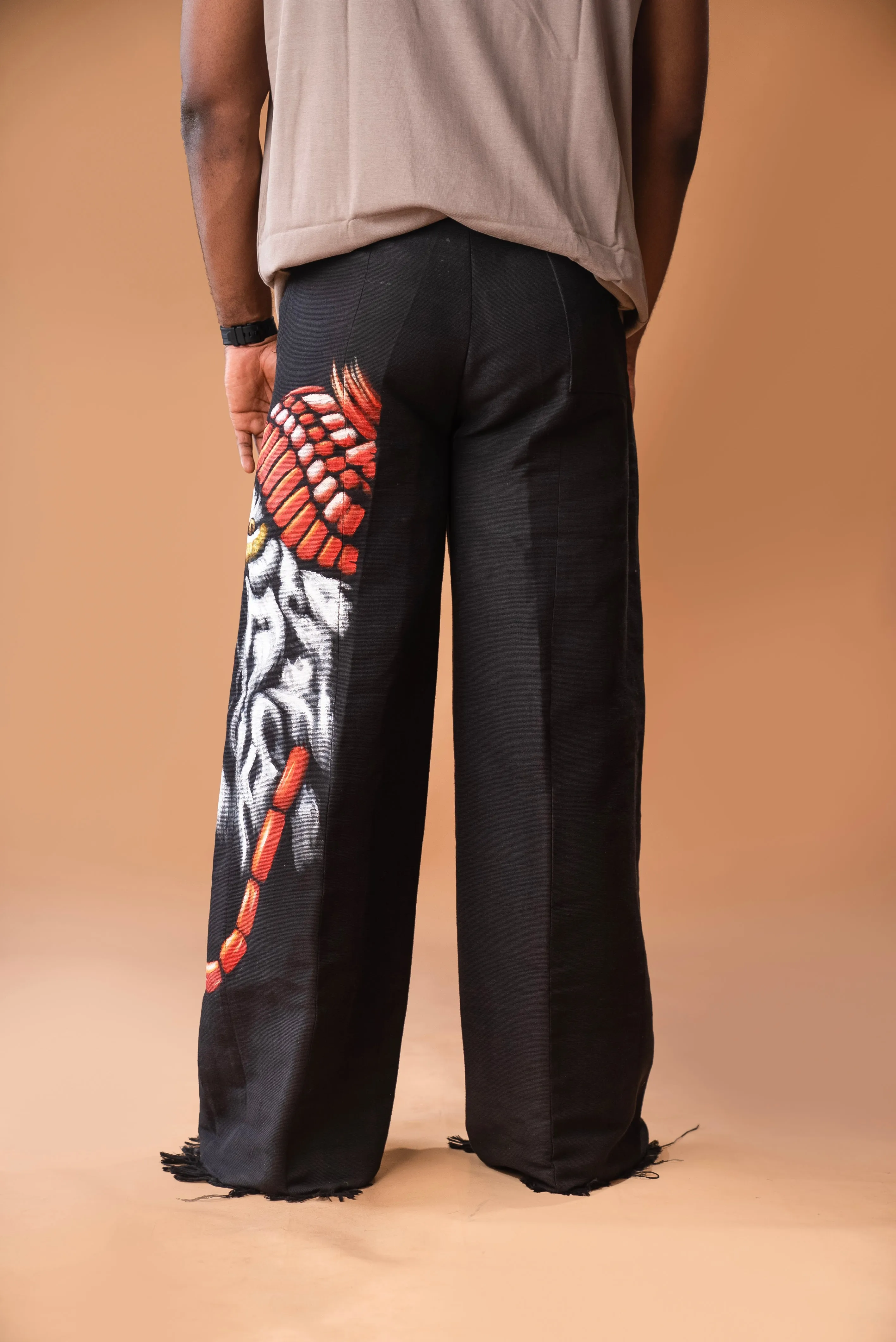 Wide-leg trousers in mixed Aso Oke Ft Hand painted Igbo Lion art